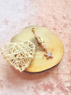 Pink charm with starfish