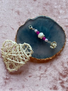 Purple beaded charm with shell