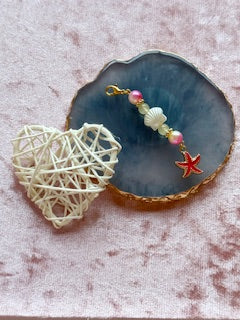 Pink beaded charm with shell
