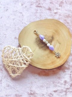 Purple pearl beaded charm with flower