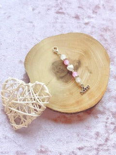 Pink beaded charm with 'love'