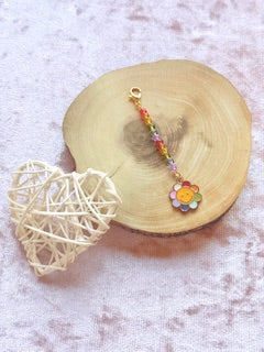 Rainbow charm with flower